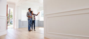 Hispanic Couple Viewing Potential New Home